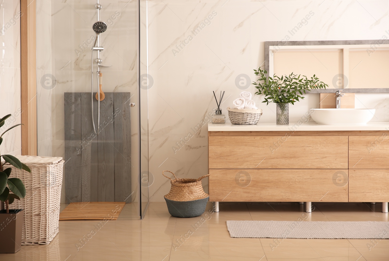 Photo of Modern bathroom interior with stylish mirror and vessel sink