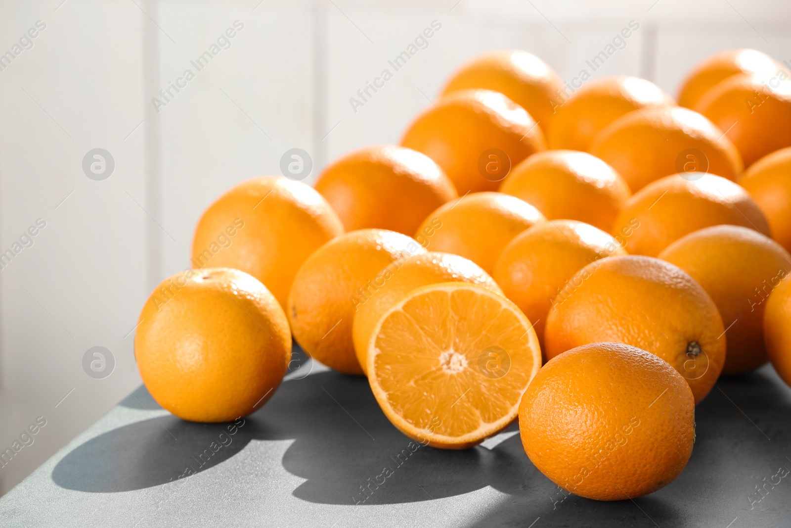 Photo of Fresh juicy oranges on table, space for text. Healthy fruits