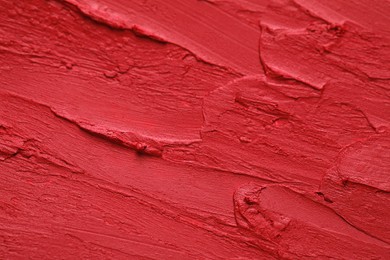 Photo of Texture of bright lipstick as background, closeup
