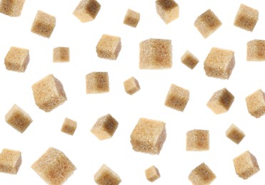 Flying cubes of brown sugar on white background