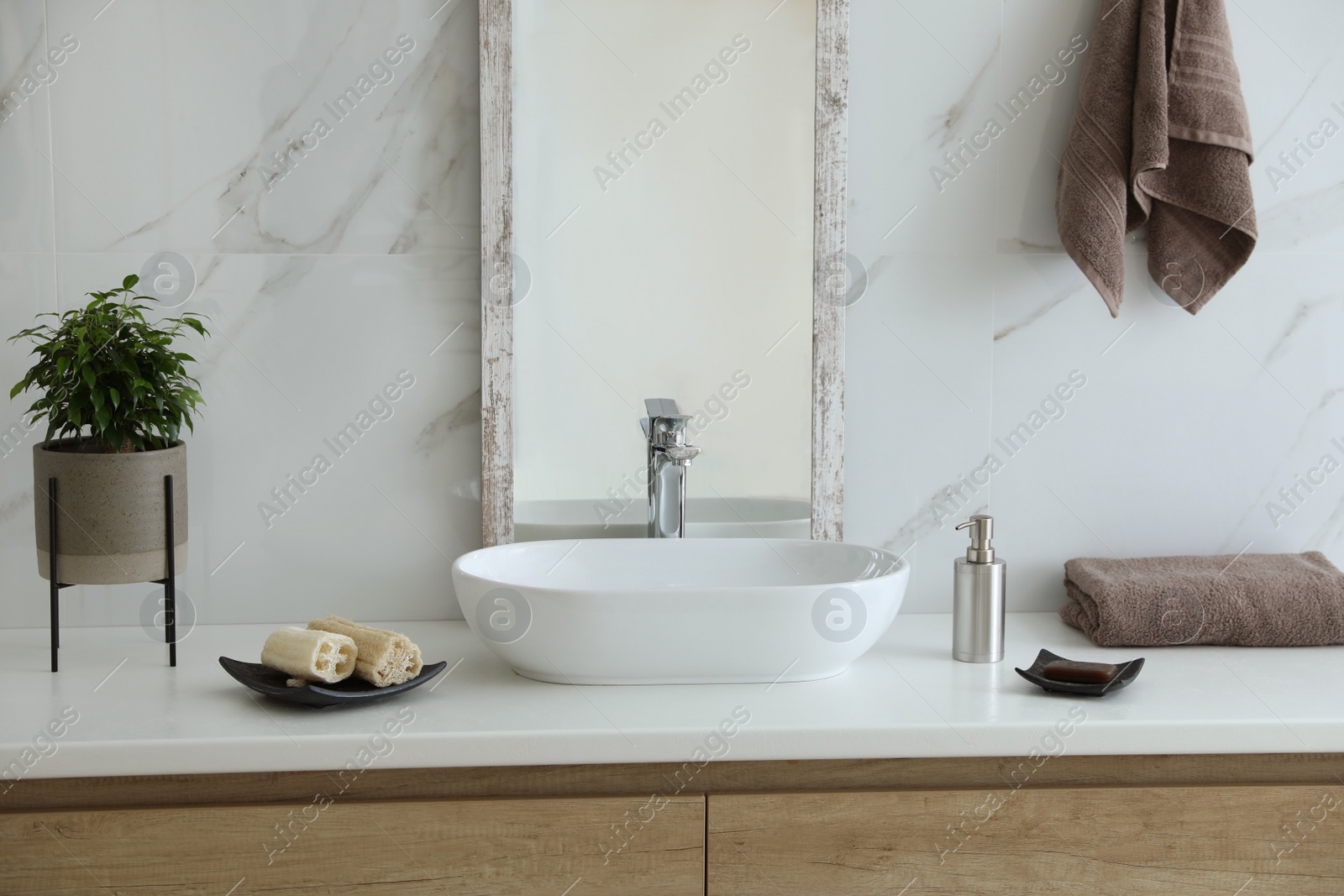 Photo of Modern bathroom interior with stylish mirror and vessel sink