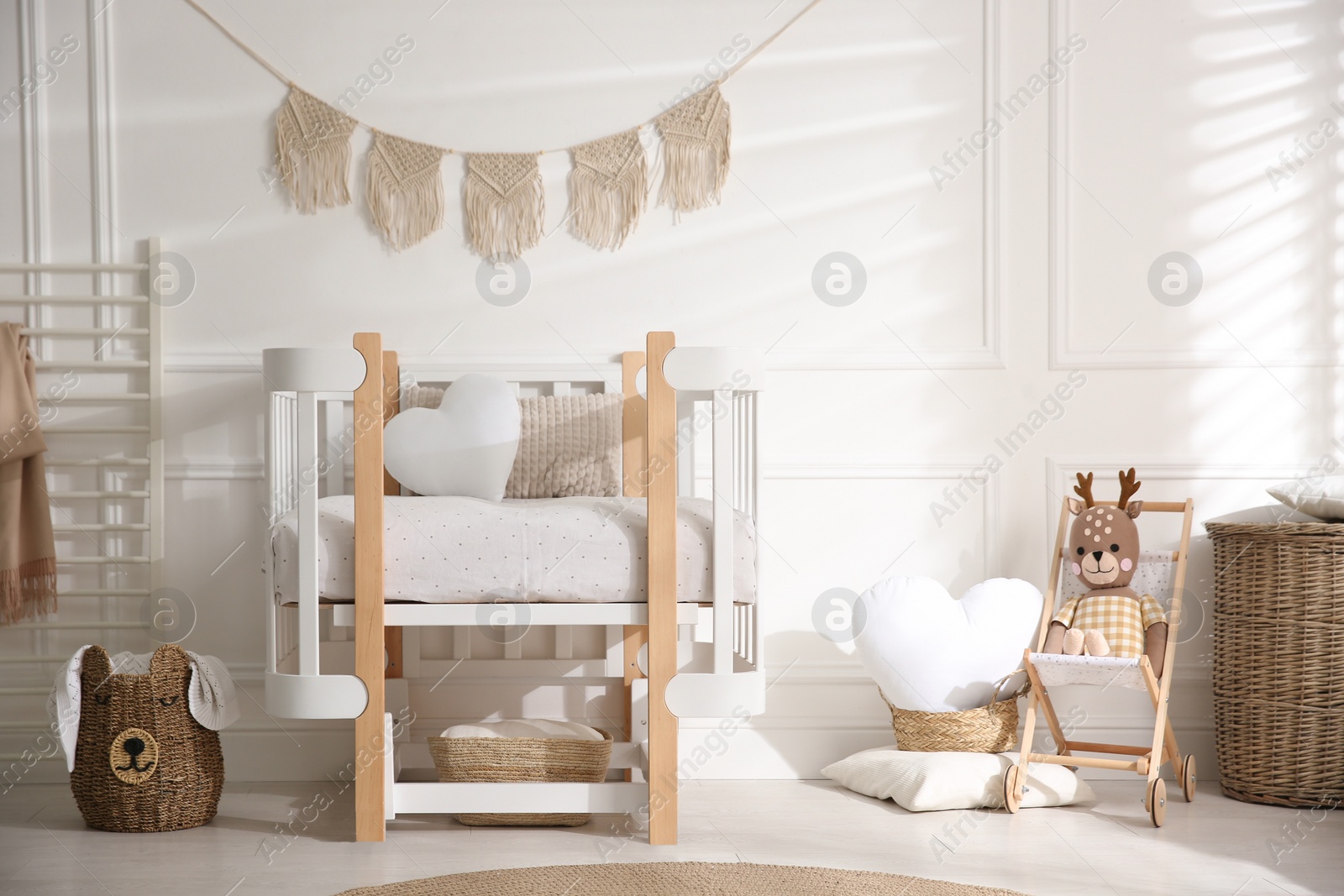 Photo of Baby room interior with stylish furniture and toys