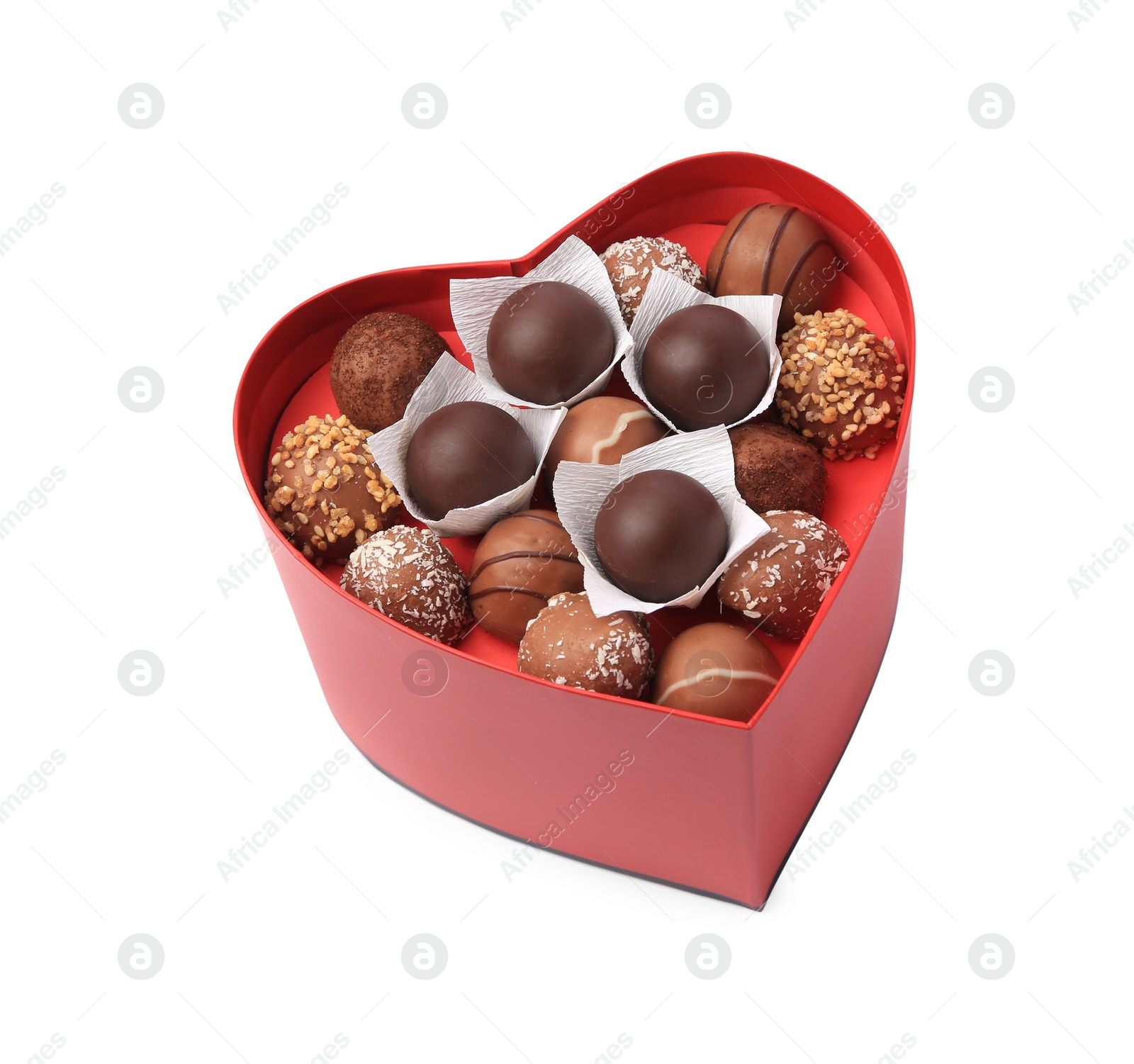 Photo of Heart shaped box with delicious chocolate candies isolated on white