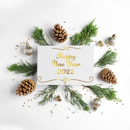 Image of Happy New 2022 Year! Composition with cones and conifer branches on white background, flat lay