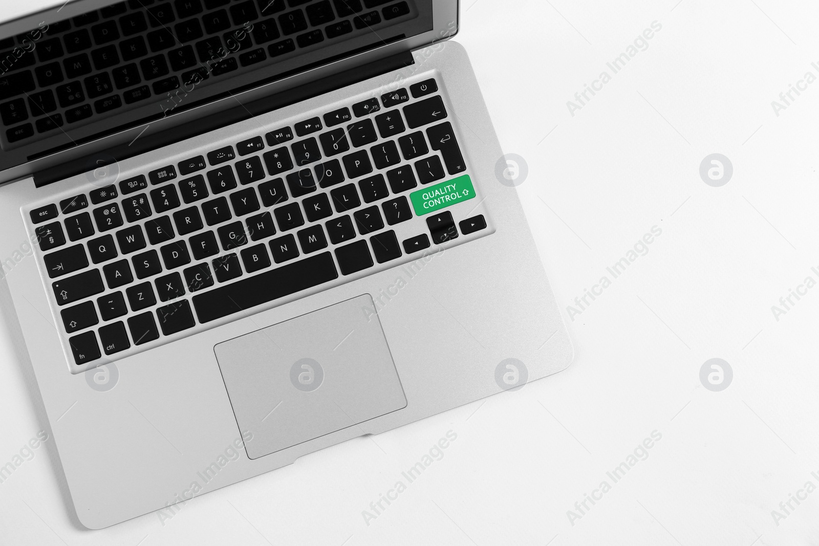 Image of Modern laptop with quality control button isolated on white, top view  