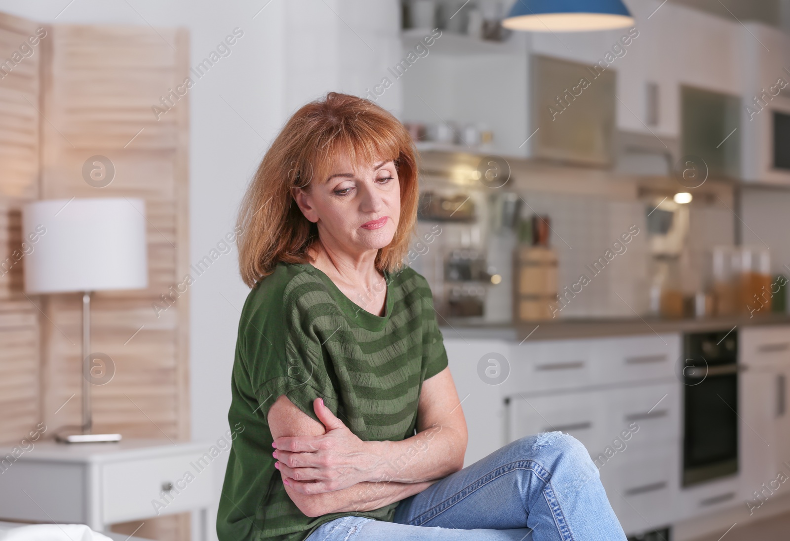 Photo of Senior woman suffering from depression at home