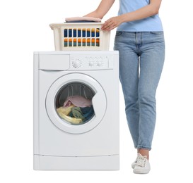 Photo of Woman with laundry basket near washing machine on white background, closeup
