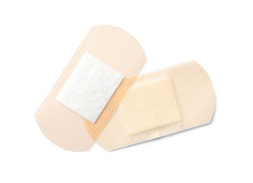 Photo of Medical sticking plasters isolated on white. First aid item