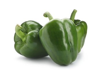 Ripe green bell peppers on white background