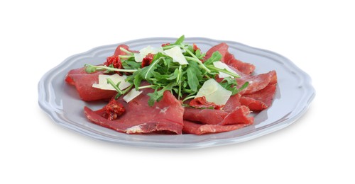 Photo of Plate of tasty bresaola salad with sun-dried tomatoes and parmesan cheese isolated on white