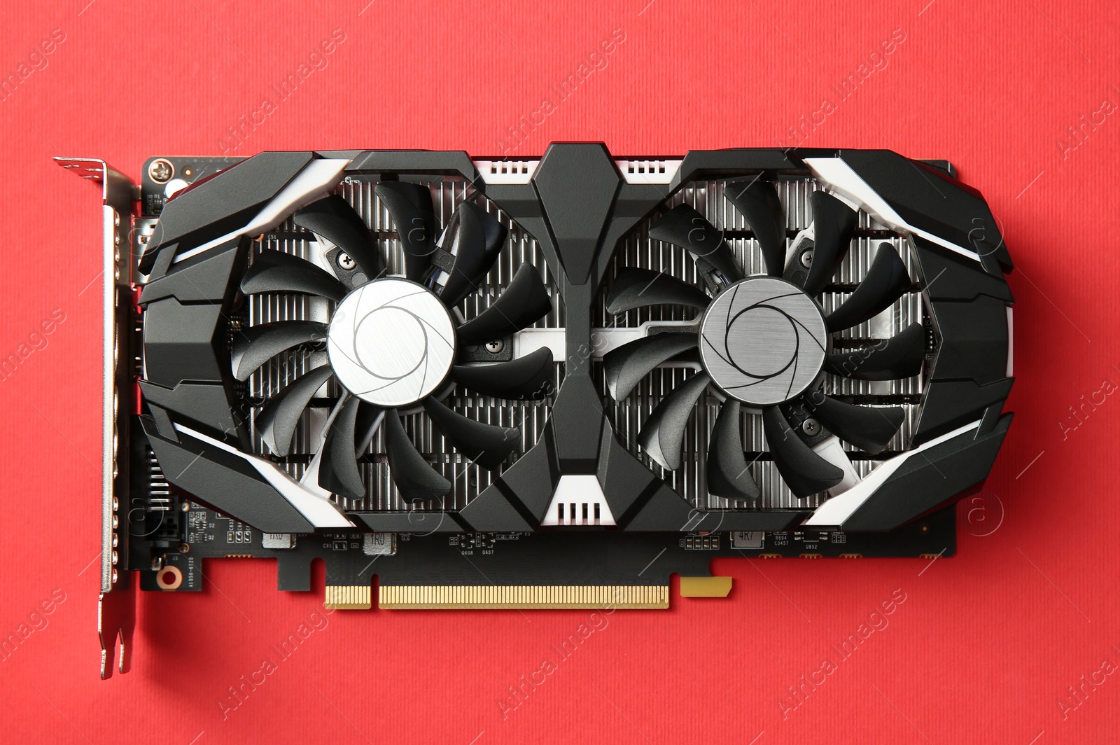 Photo of Computer graphics card on red background, top view