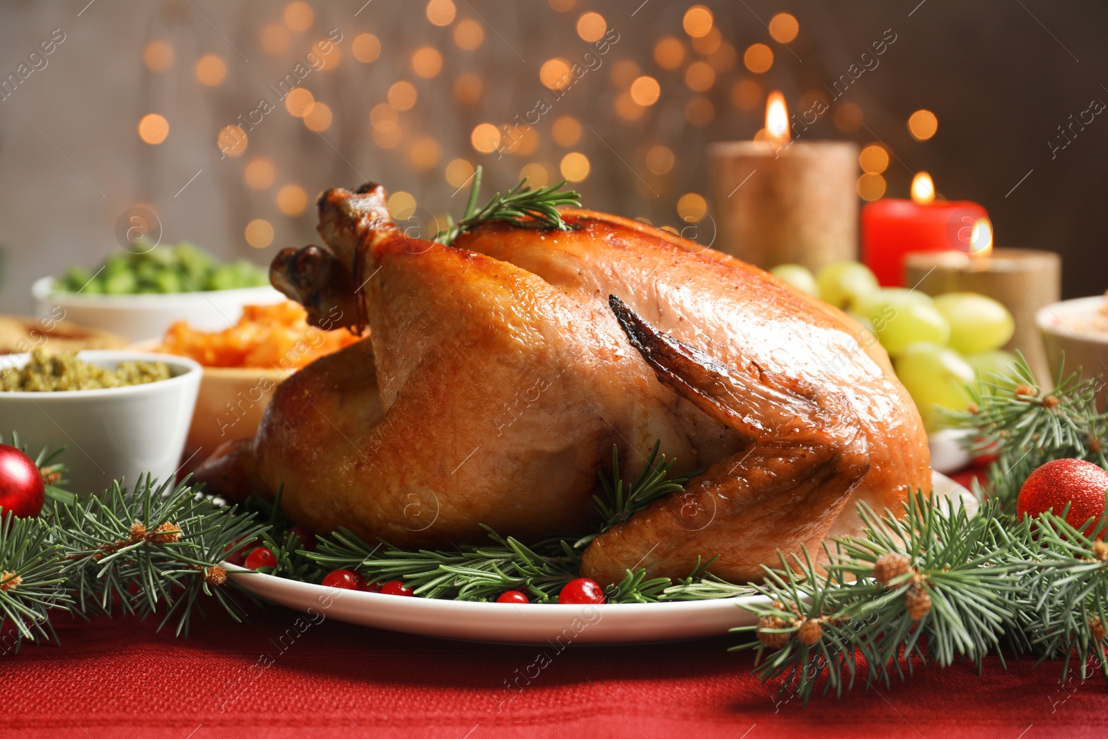 Photo of Traditional festive dinner with delicious roasted turkey served on table