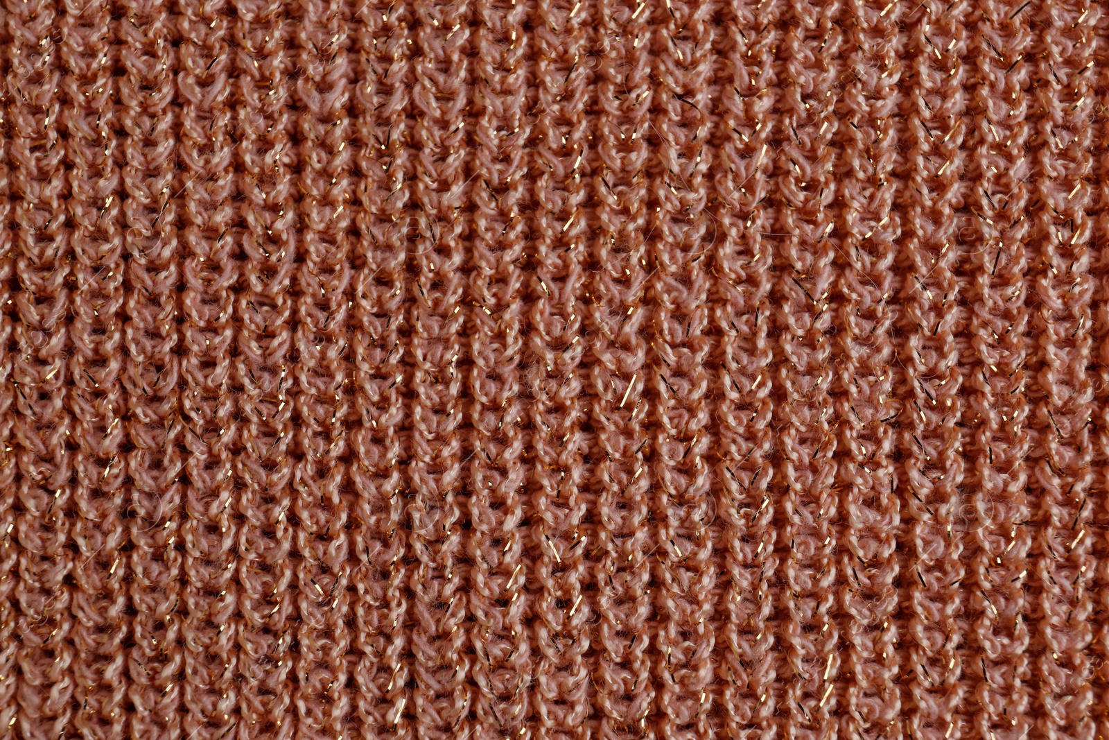 Photo of Brown knitted fabric as background, top view