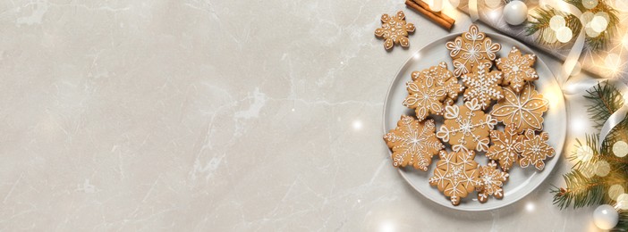 Image of Tasty Christmas cookies and festive decor on light grey marble table, flat lay with space for text. Horizontal banner design