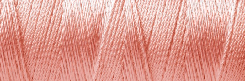 Texture of rose gold thread, closeup view. Banner design