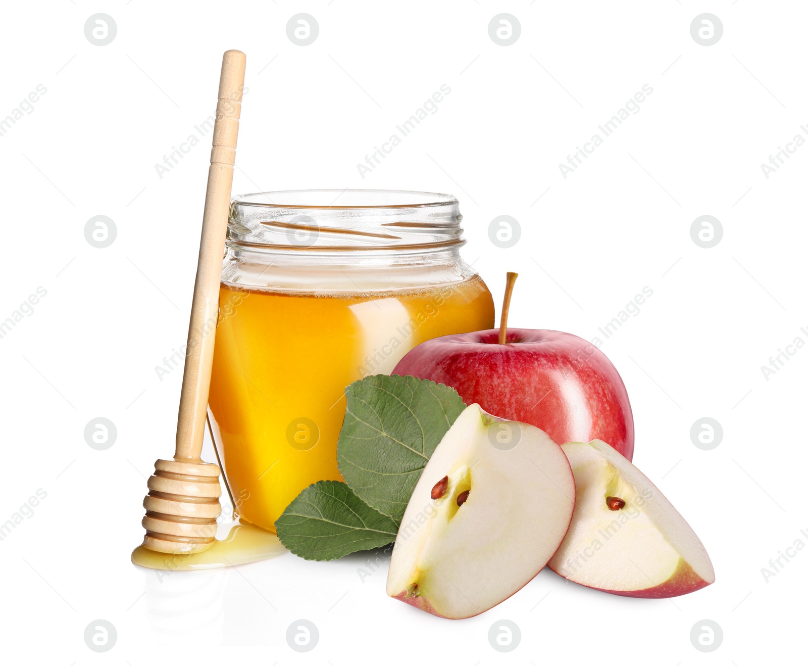 Image of Honey in glass jar, apples and dipper isolated on white