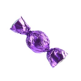 Tasty candy in purple wrapper isolated on white