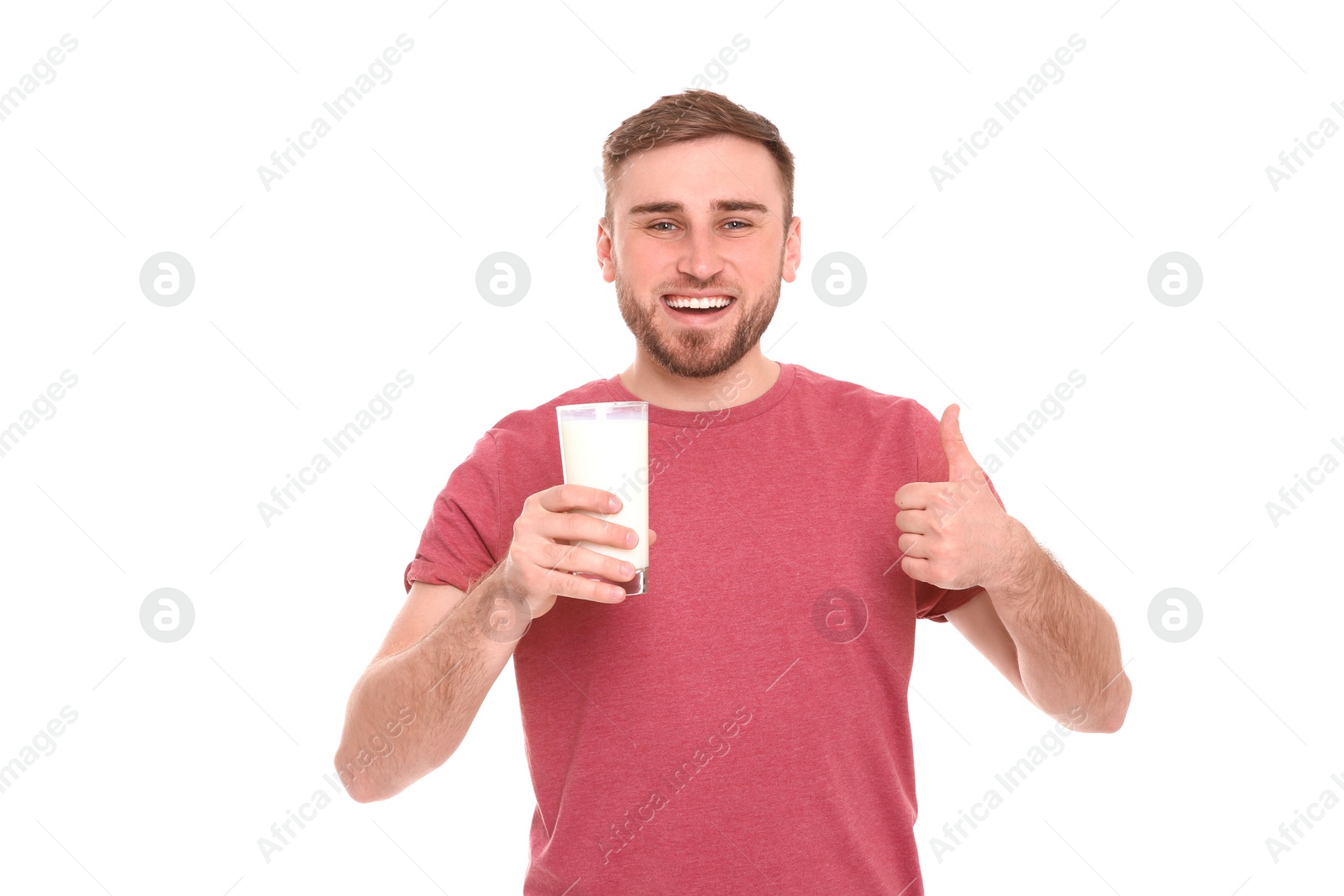 Photo of Young man with glass of tasty milk on white background