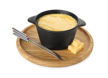 Photo of Fondue with tasty melted cheese, forks and pieces isolated on white