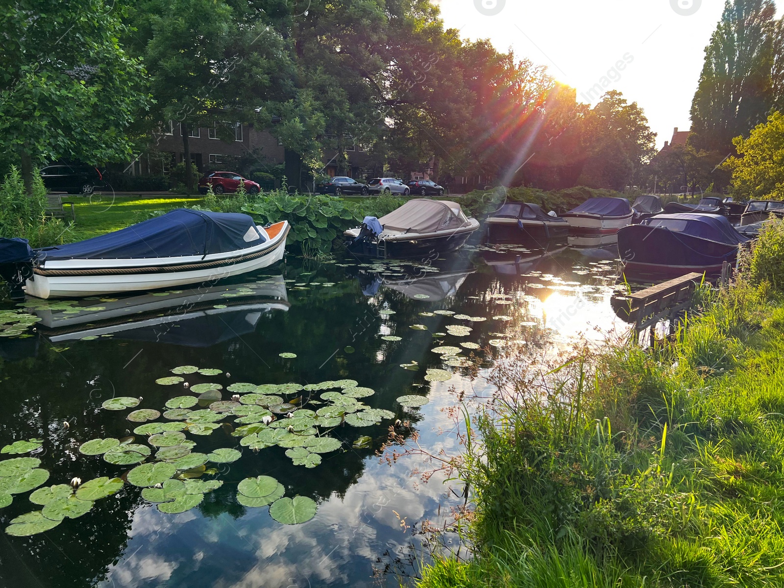 Photo of Beautiful view of moored boats in canal on sunny day