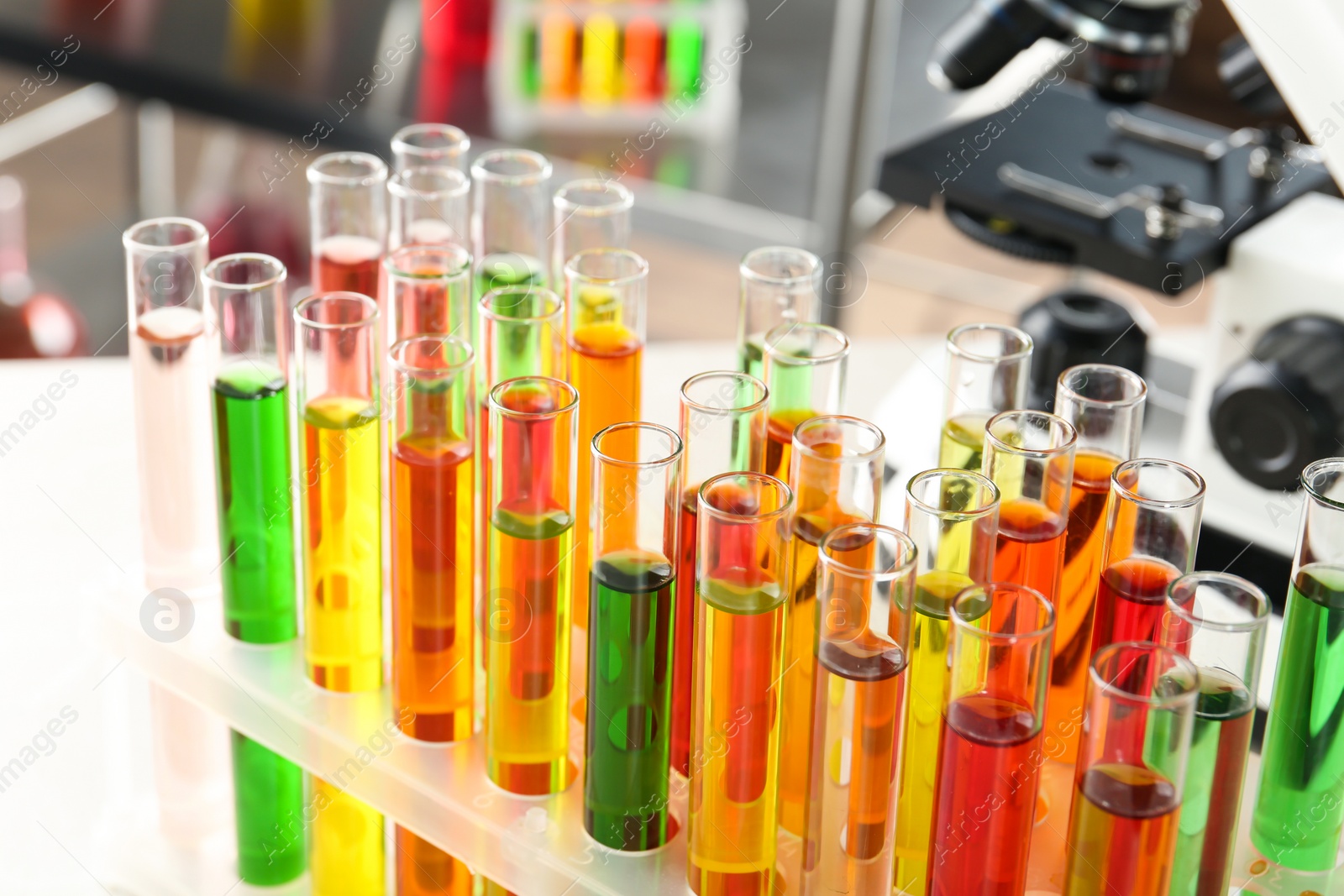 Photo of Test tubes with samples in chemistry laboratory, closeup