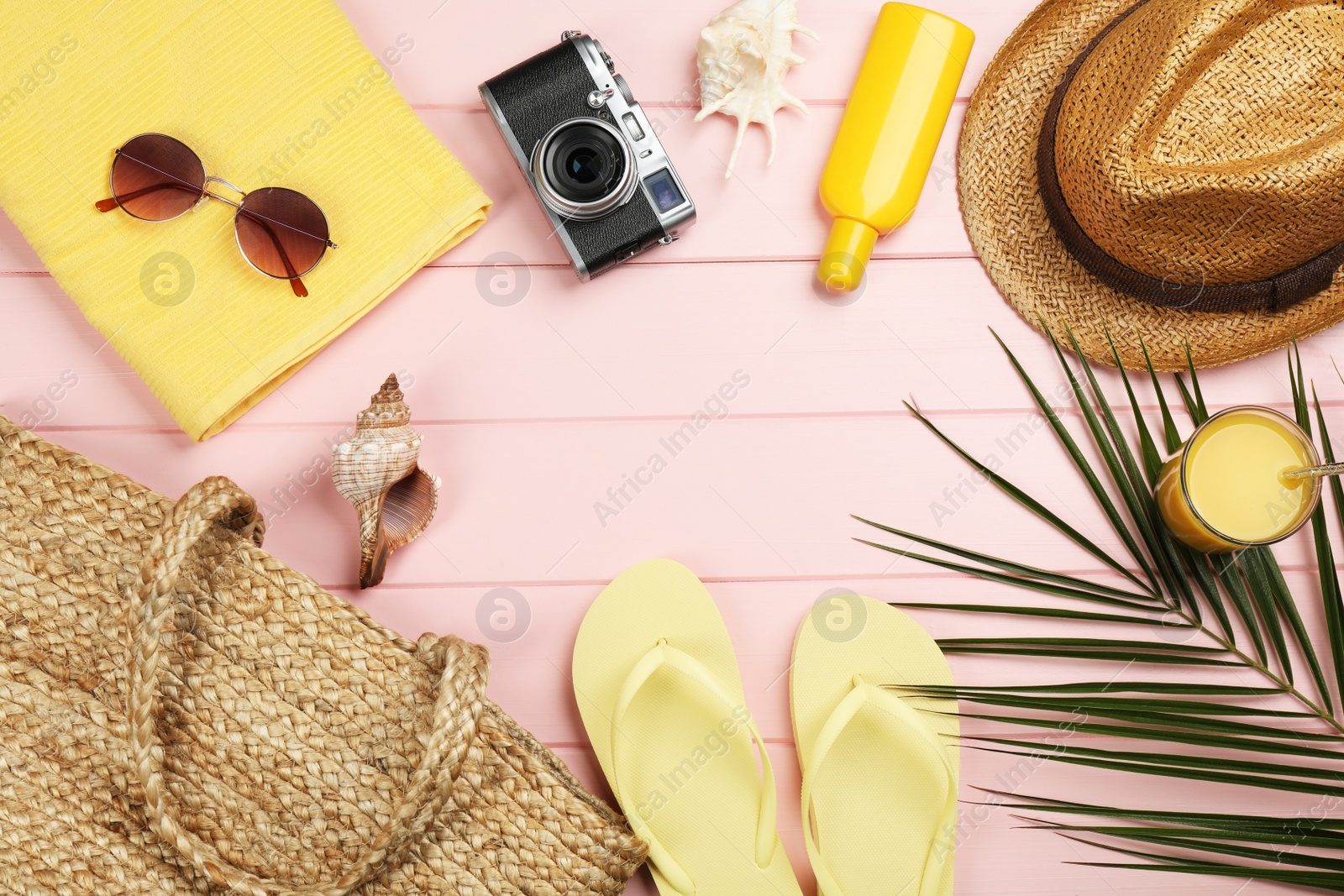 Photo of Frame of beach objects on pink wooden background, flat lay. Space for text