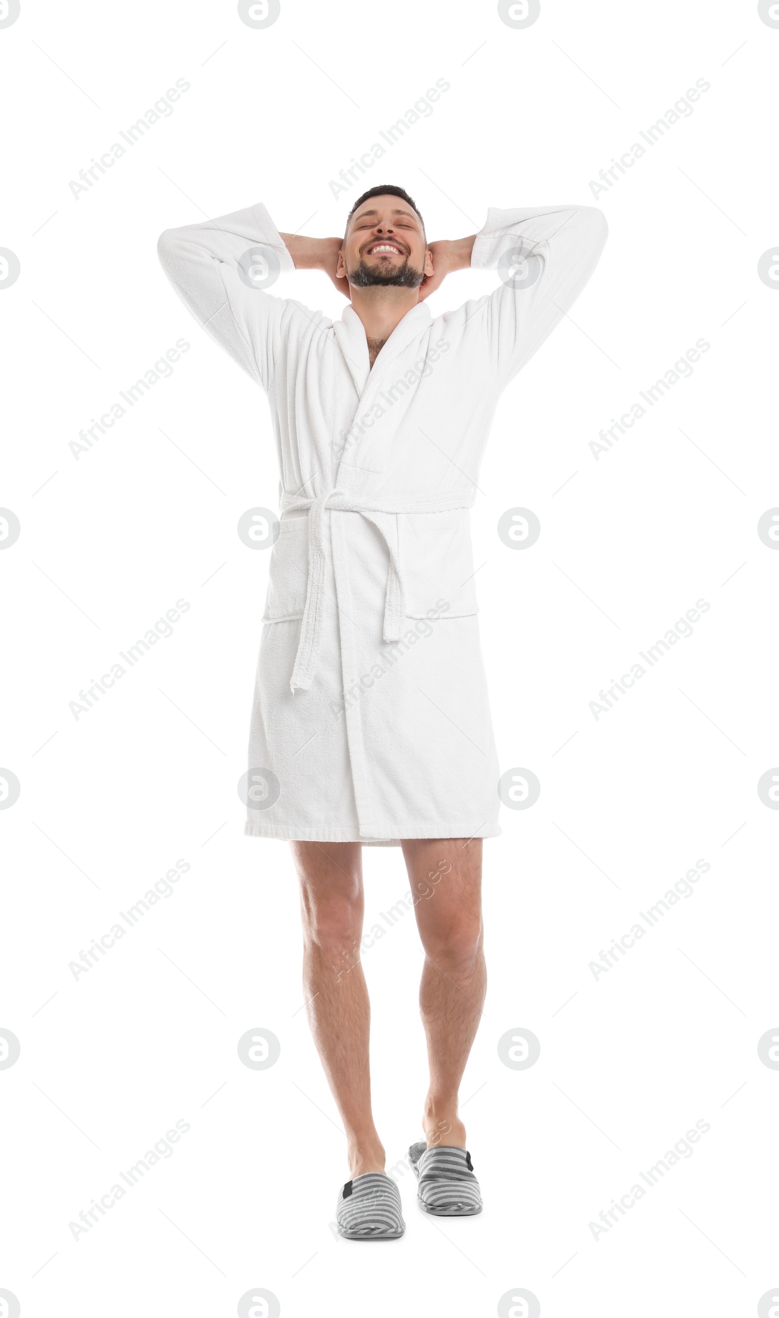 Photo of Handsome man wearing bathrobe on white background