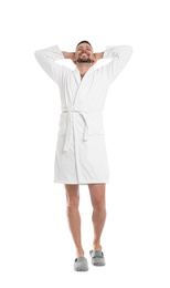 Photo of Handsome man wearing bathrobe on white background