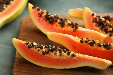 Fresh sliced papaya fruit on table, closeup