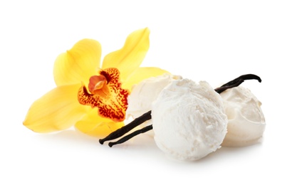 Photo of Balls of tasty vanilla ice cream and flower on white background