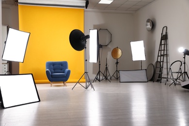 Photo of Interior of modern photo studio with professional equipment