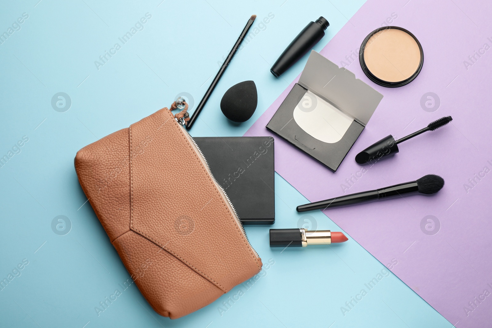 Photo of Flat lay composition with facial oil blotting tissues and makeup products on color background. Mattifying wipes