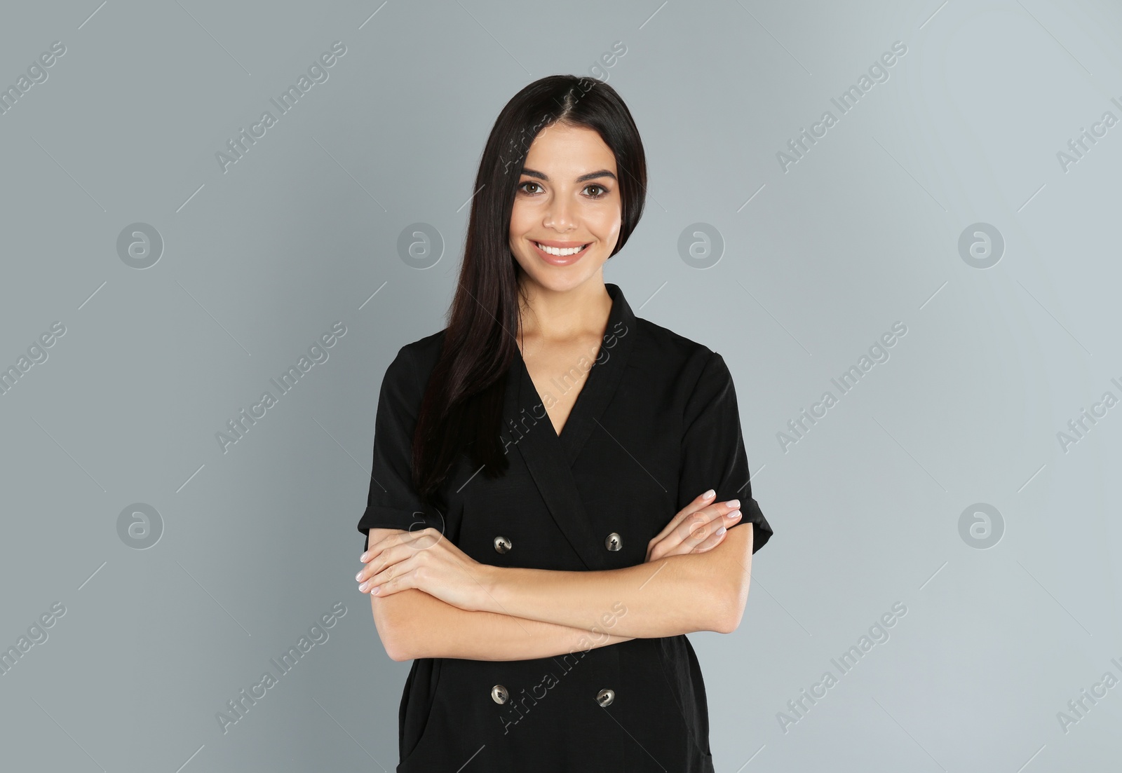 Photo of Portrait of young woman on light grey background