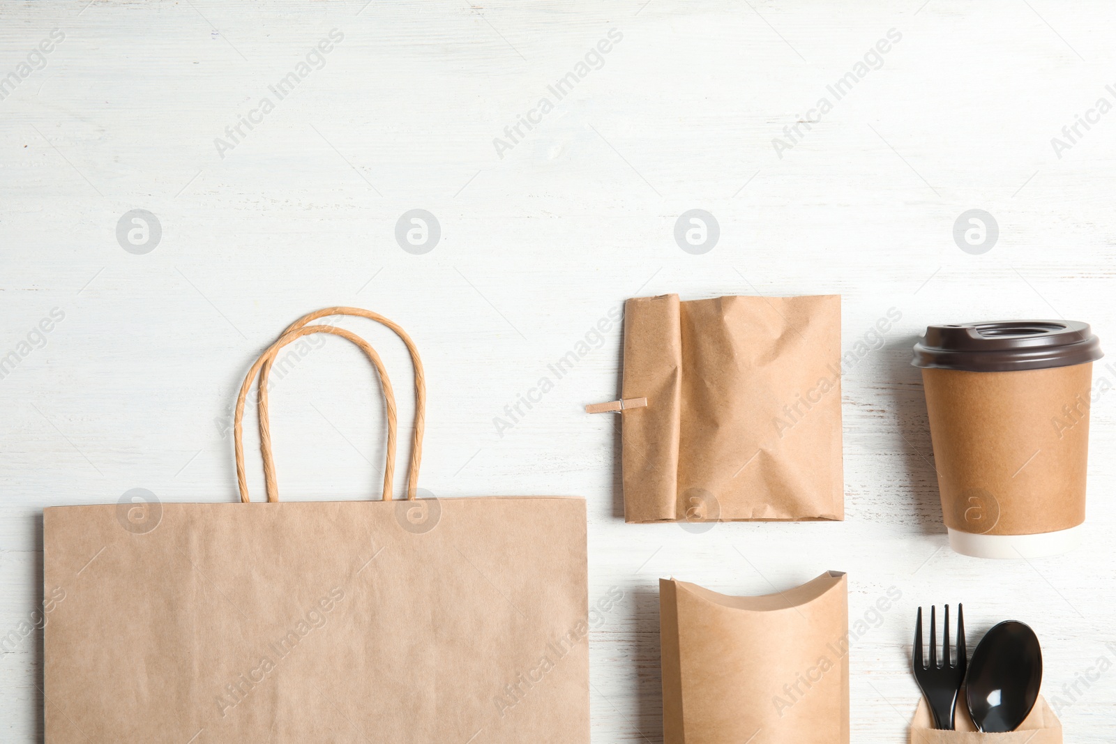 Photo of Different containers for mock up design on wooden background, flat lay. Food delivery service