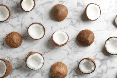 Photo of Coconut pattern on marble table, flat lay