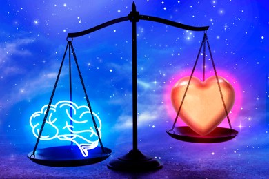 Image of Choosing between logic and emotions. Scales with glowing heart and illustration of brain against starry sky