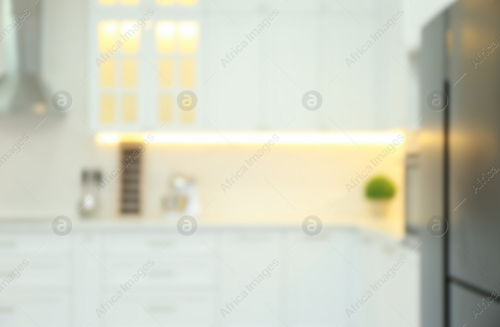 Photo of Blurred view of modern kitchen interior with stylish furniture