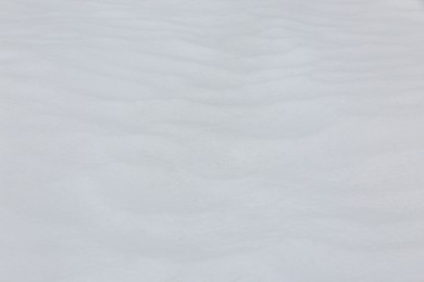 Photo of Clear white snow as background, closeup. Winter season