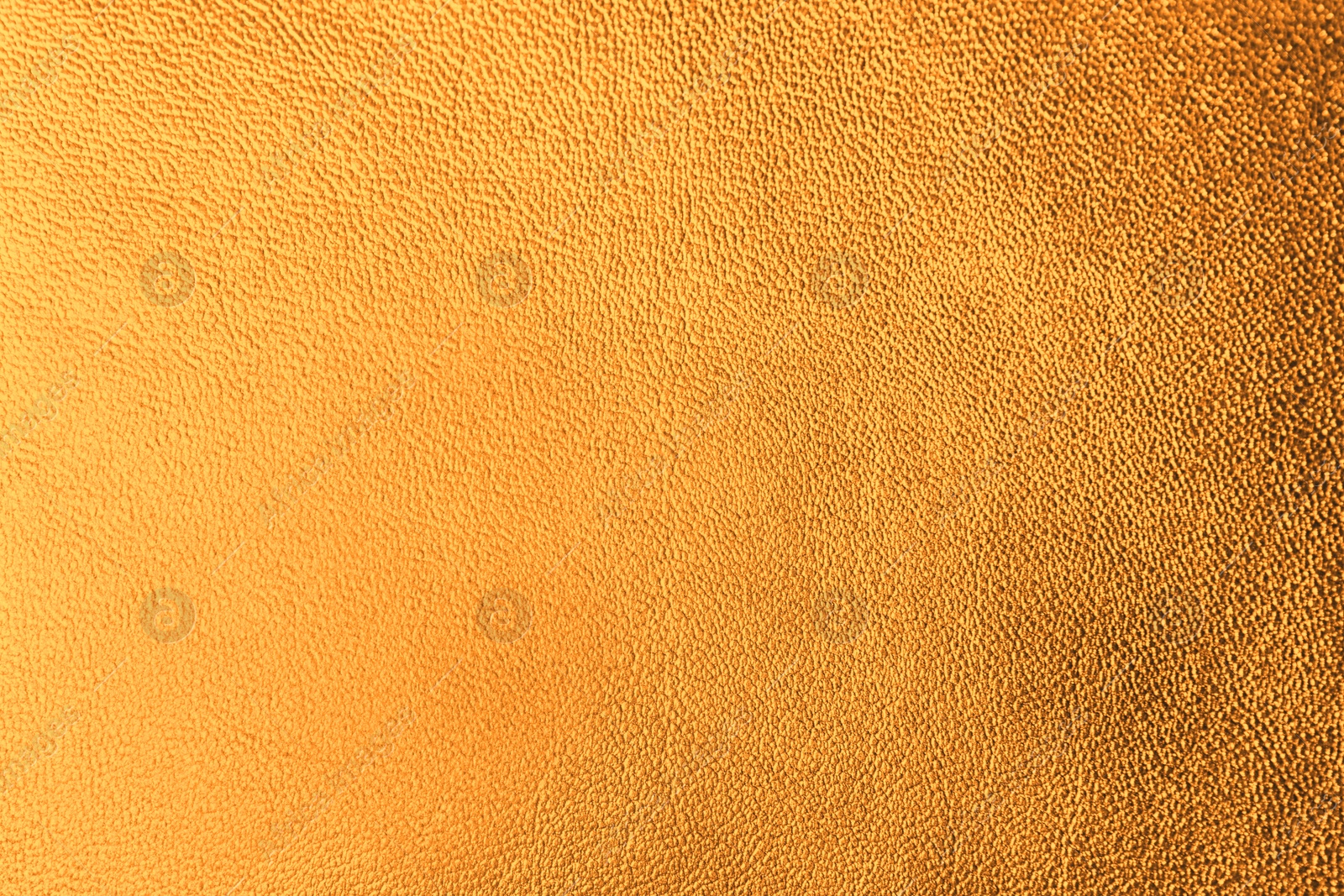 Image of Golden textured surface as background, closeup view