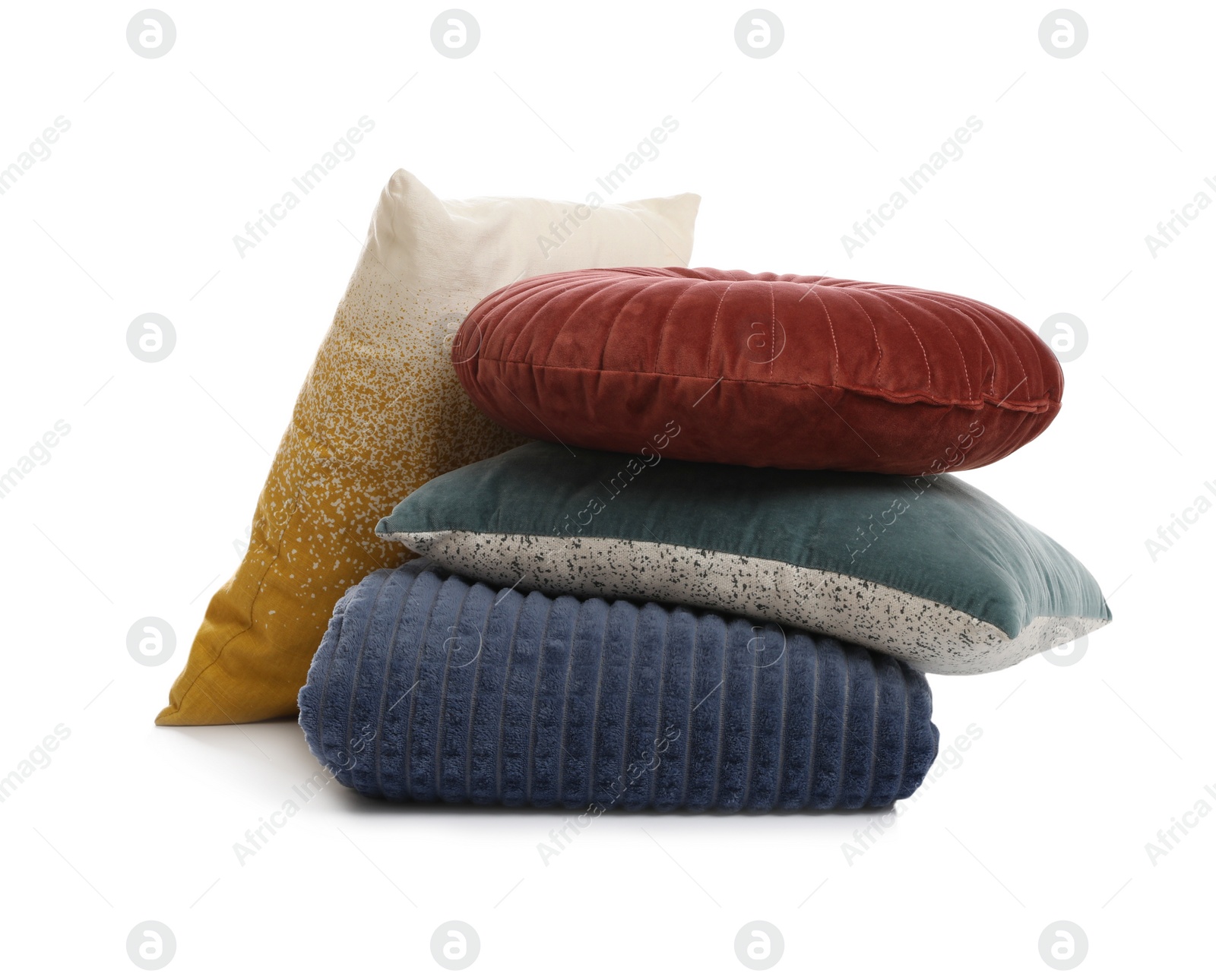 Photo of Stylish soft pillows and folded blanket on white background