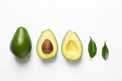 Composition with ripe fresh avocados on white background