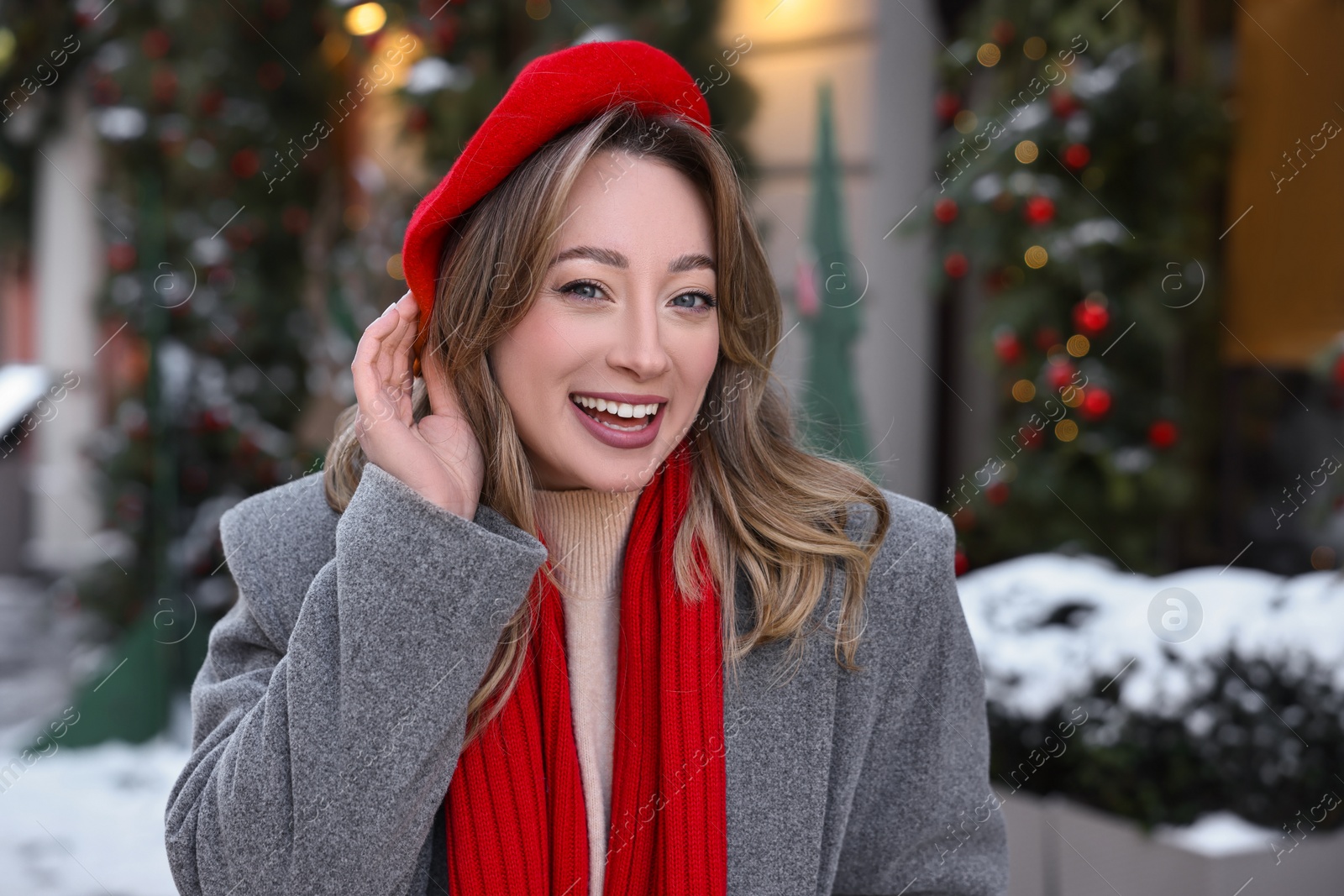 Photo of Portrait of happy woman on city street in winter