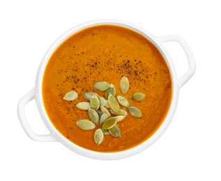 Photo of Delicious pumpkin cream soup with seeds in bowl isolated on white, top view