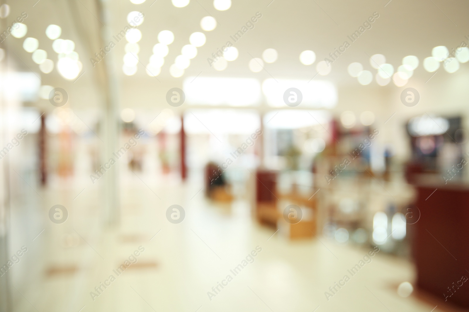 Photo of Blurred view of modern shopping mall interior