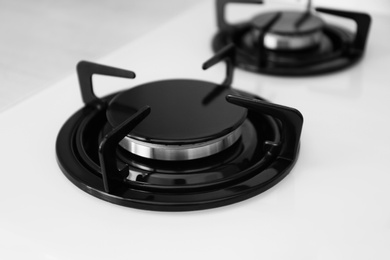 Modern built-in gas cooktop, closeup. Kitchen appliance