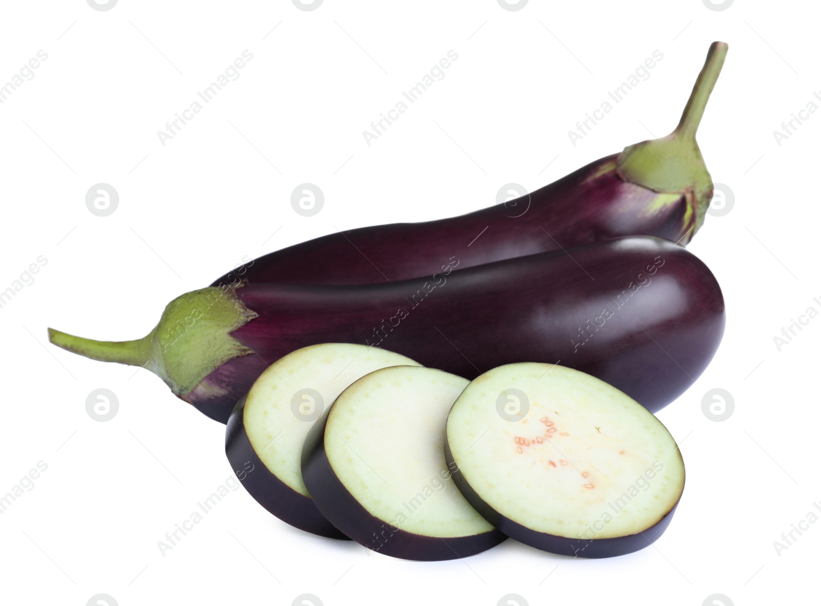 Photo of Cut and whole fresh ripe eggplants on white background