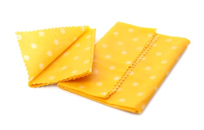 Photo of Reusable beeswax food wraps on white background