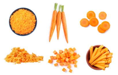 Image of Set with cut fresh carrots on white background