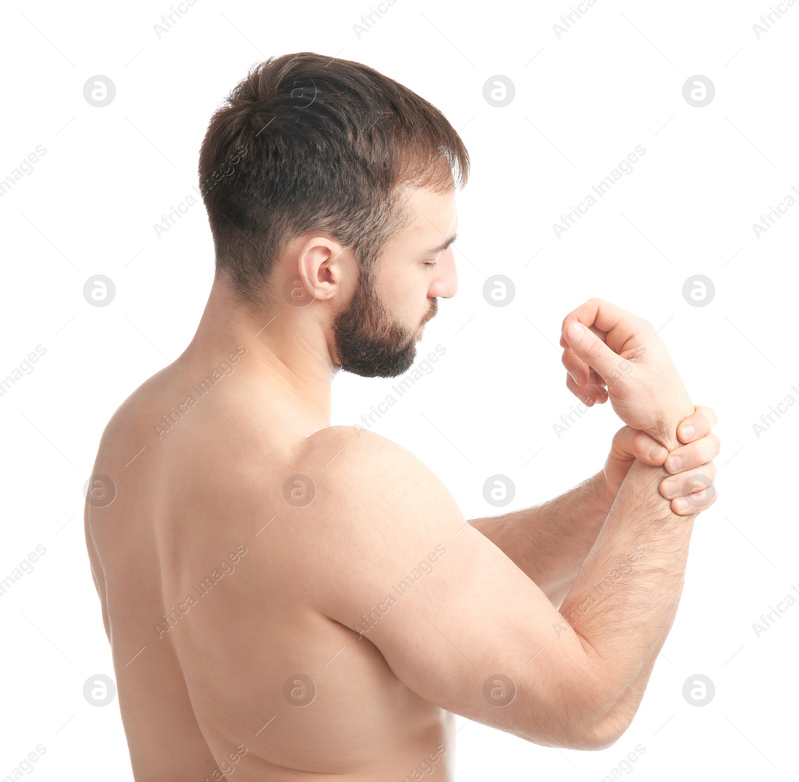 Photo of Young man suffering from pain in wrist on white background