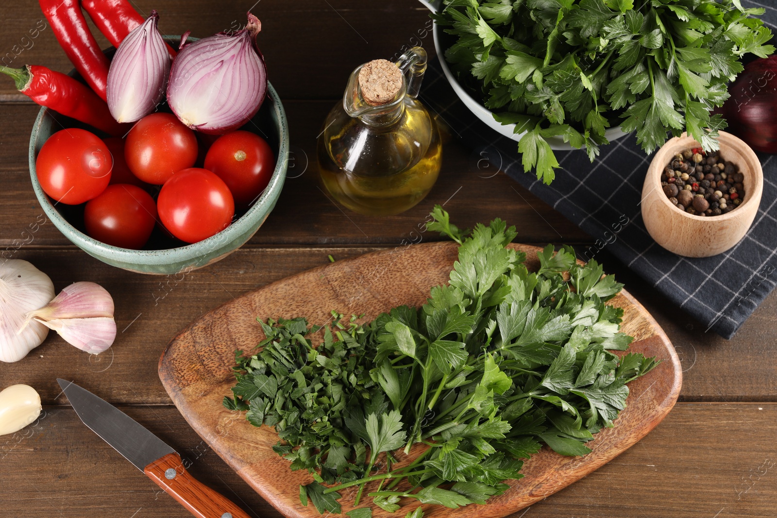 Photo of Fresh green parsley and different products on wooden table, flat lay